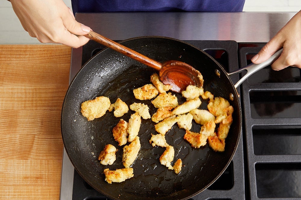 recipe-step-image-Coat & cook the chicken}