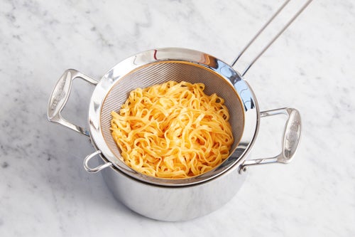recipe-step-image-Cook the noodles & serve your dish}