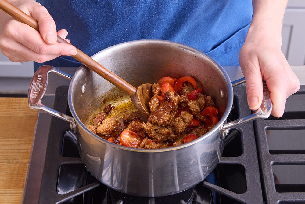 recipe-step-image-Cook the pork & tomatoes}